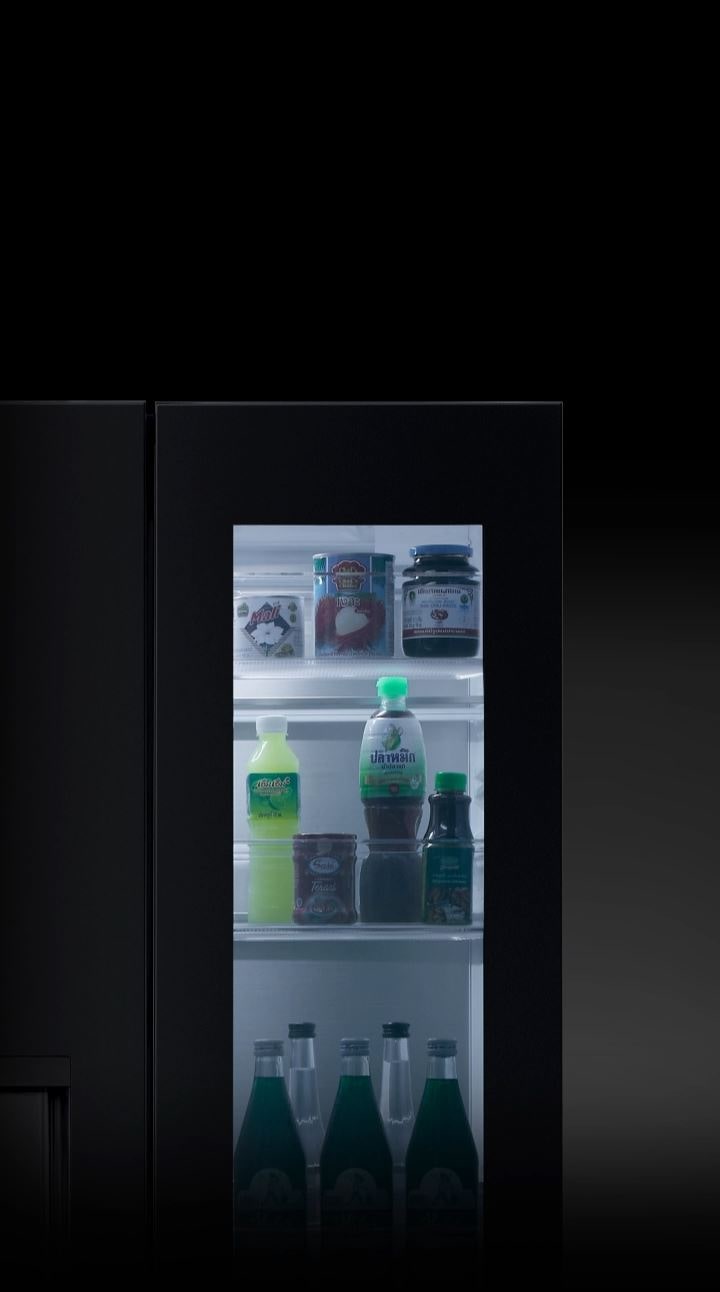 The lg refrigerator door is knocked on twice, and the InstaView light turns on, revealing the food items inside without opening the door.	