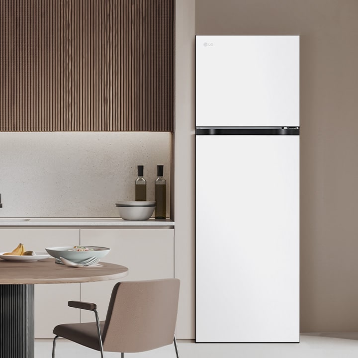 LG top freezer refrigerator is in modern kitchen, showcasing overall design of the refrigerator.	