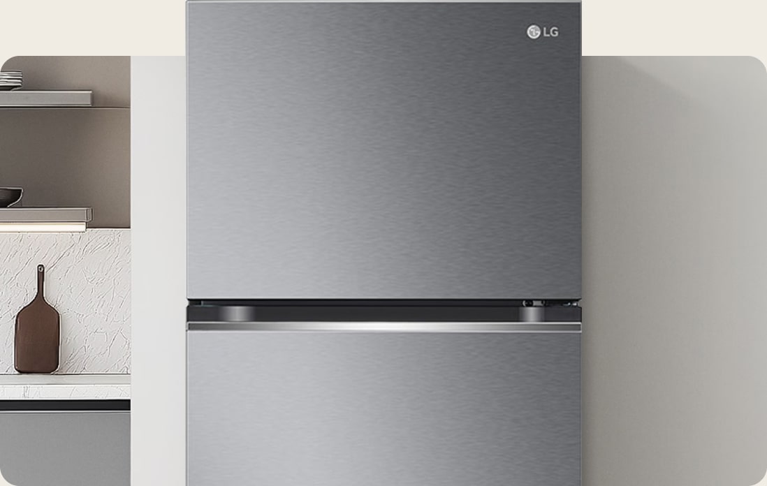 Close-up LG refrigerator freezer with a dark graphite finish and seamlessly integrated into a neutral tone modern kitchen.