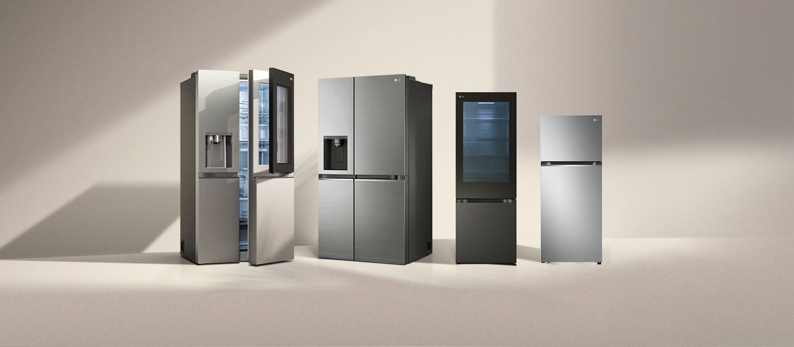 Four LG refrigerator freezers in the sun. Left multi-door refrigerator with side-by-side and two-door one-door models next to it.