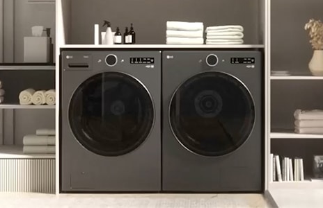 LG Washing Machine standing on the left, with an installation box placed on the right side against the wall.	