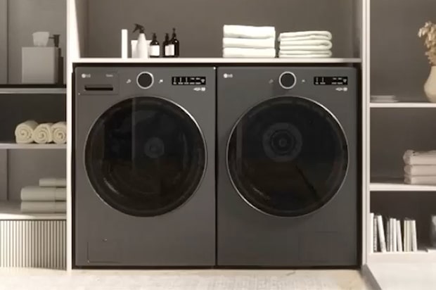 LG Washing Machine standing on the left, with an installation box placed on the right side against the wall.	
