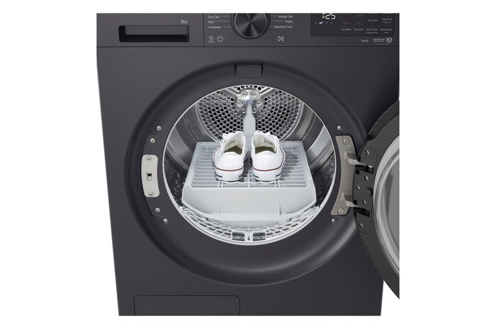 LG DXH3 Heat Pump Dryer with front door open, showing the drum interior.
