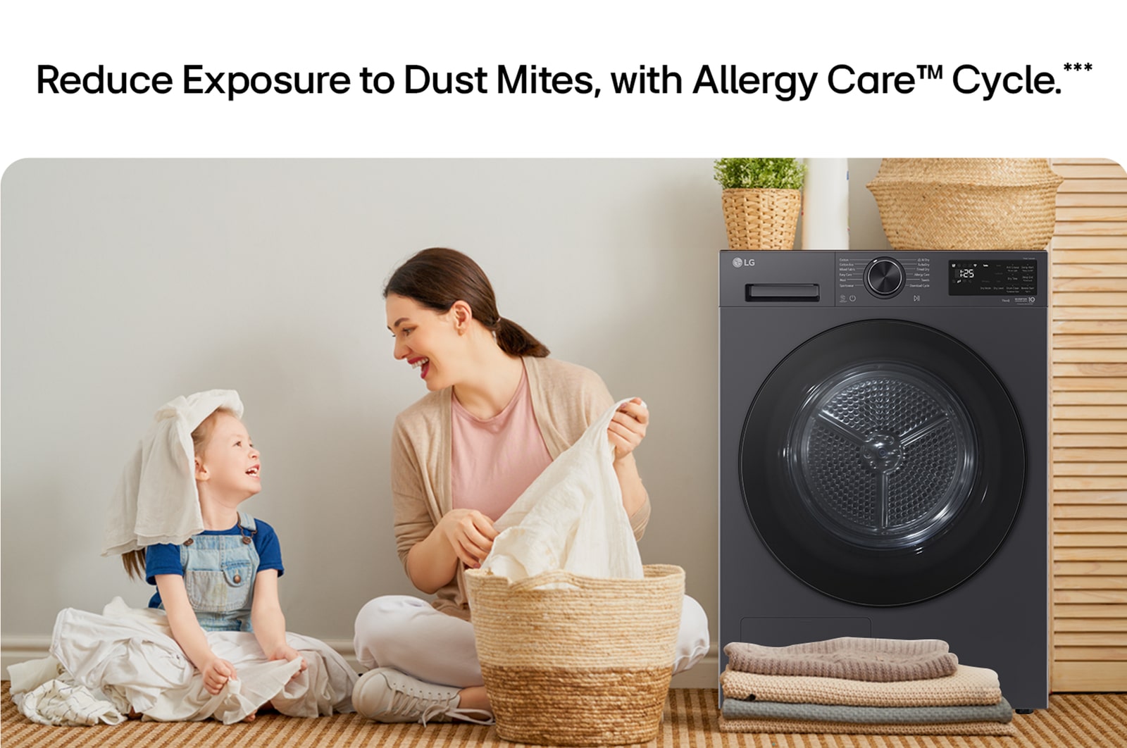 Reduce Exposure to Dust Mites, with Allergy Care™ Cycle. Family laundry room scene with a parent and child folding clothes next to an LG dryer.