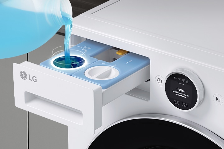 The detergent compartment is open, and the detergent is being poured into the auto dose dispenser.