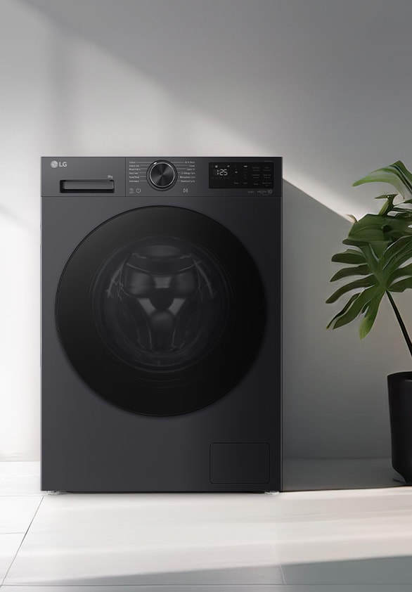 Front-load washing machine placed in a modern laundry space