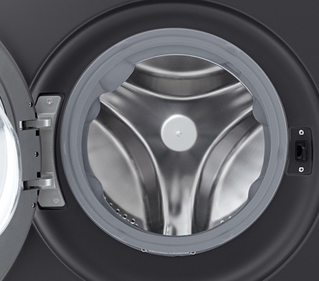 Close-up of the washing machine drum with the door open