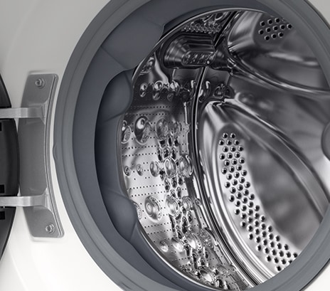 Close-up of the washing machine drum with the door open