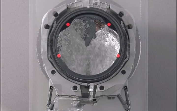 Image shows 4 streams of water coming out from the top and bottom of the drum.