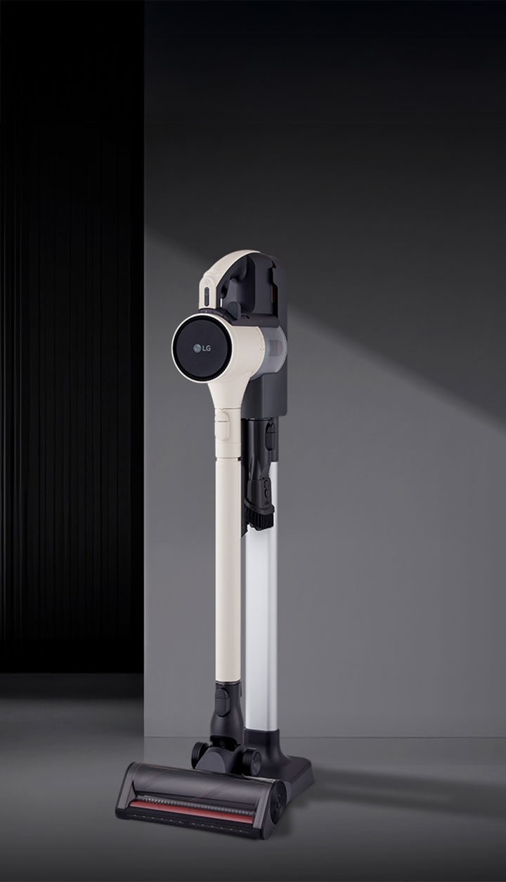 A9L vacuum standing upright in a modern room setting.