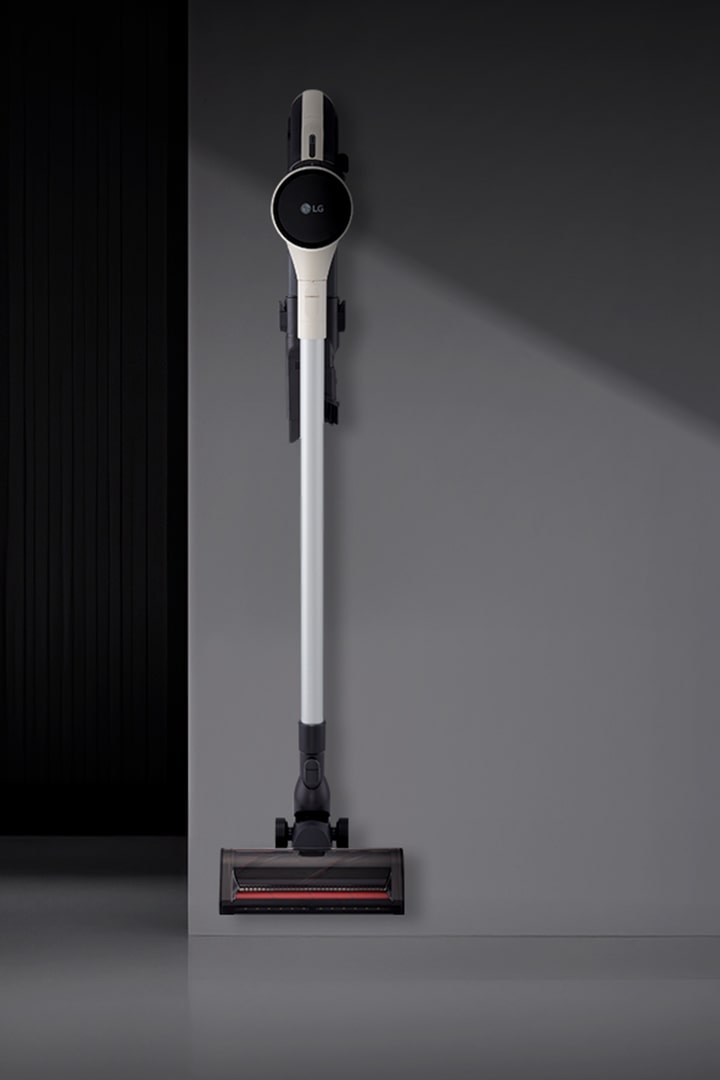 A9L vacuum wall-mounted in a modern room setting.