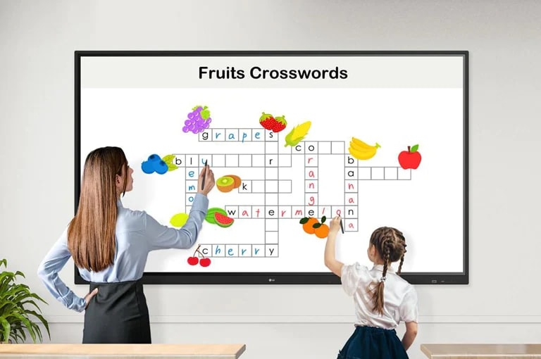 A teacher and a child are solving crosswords puzzles on the display together, using the Stylus Pens.