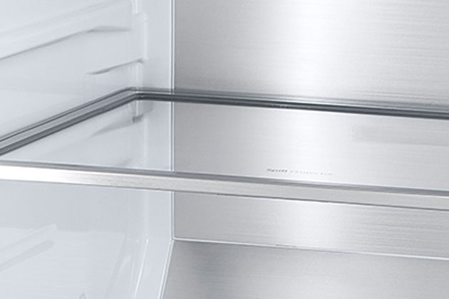 A diagonal view of the shelf with metallic paneling on the interior of the refrigerator.