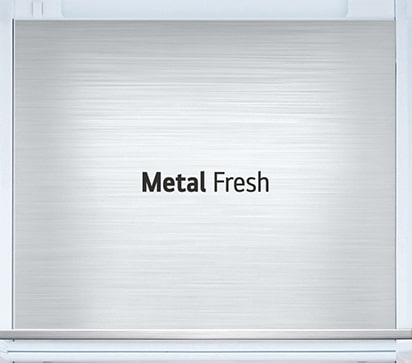 A diagonal view up into the top of the refrigerator showing the soft LED lighting.