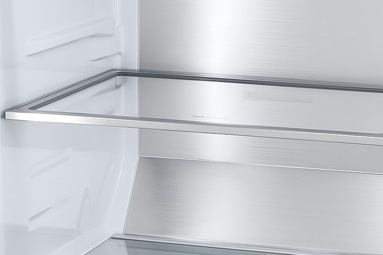 Inside the refrigerator, a slim indoor ice maker is highlighted in blue and the refrigerator is full of ingredients
