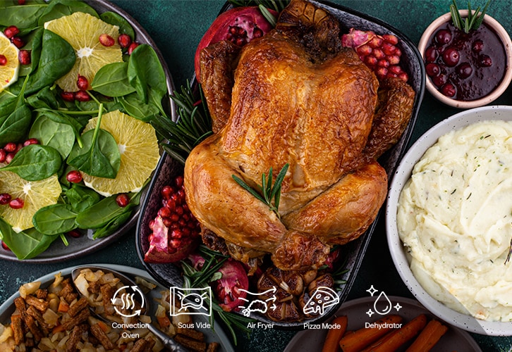 This is an image of steamed chicken breasts, air-fried chicken wings, cookies, and air sous vide steak on the table. Icons representing ProBake convection, air sous vide, air fry, and ProBake steam functions are also included below.