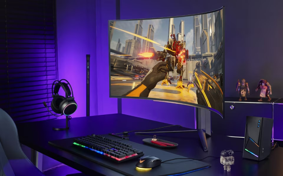 LG curved gaming monitor on a sleek desk setup with RGB lighting, designed for a comfortable and immersive gaming experience.