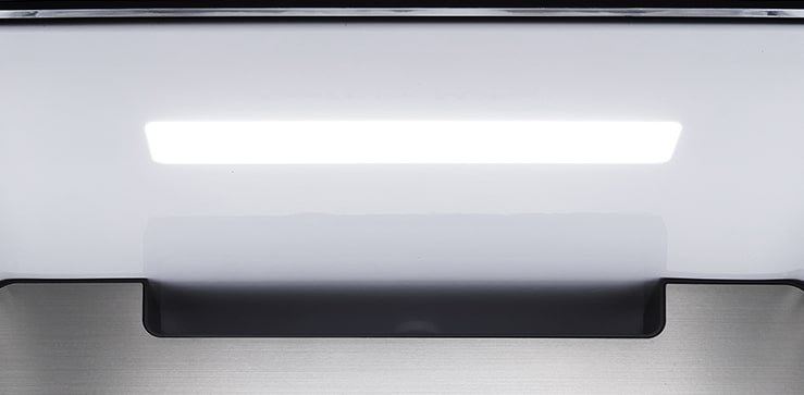 A diagonal view up into the top of the refrigerator showing the soft LED lighting.