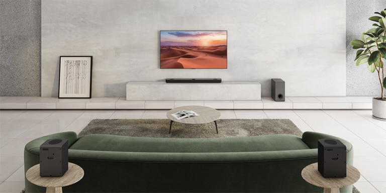 There is TV showing a nature image. A sound bar, a subwoofer, and 2 rear speakers in a wide living room. A wave with grid is coming out from sound bar, measuring the entire space of living room.