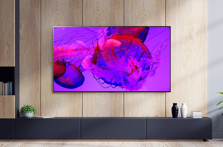 An image of LG OLED G3 on the wall of an ornate room showcasing its One Wall Design. A side view of LG OLED G3's incredibly slim dimensions. An angled view of LG OLED G3 on the wall of a city view apartment with a Soundbar below.