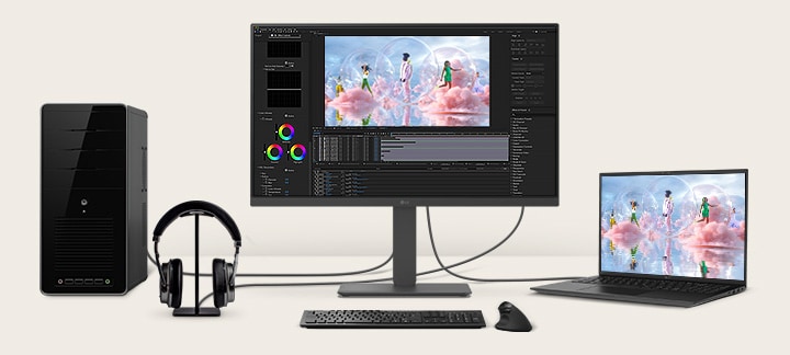 Front view showing a workstation with multiple devices connected to monitors.	