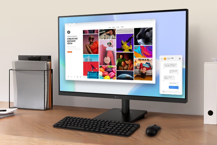 A workspace on a desk with a IPS FHD monitor and document holder.