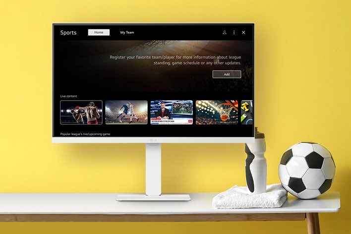 The LG Smart Monitor screen is showing live sports channels.	