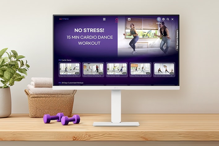 The LG Smart Monitor screen is showing various LG Fitness videos.	
