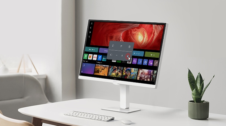 The LG Smart Monitor Swing screen shows the webOS interface, and the volume is being turned up.