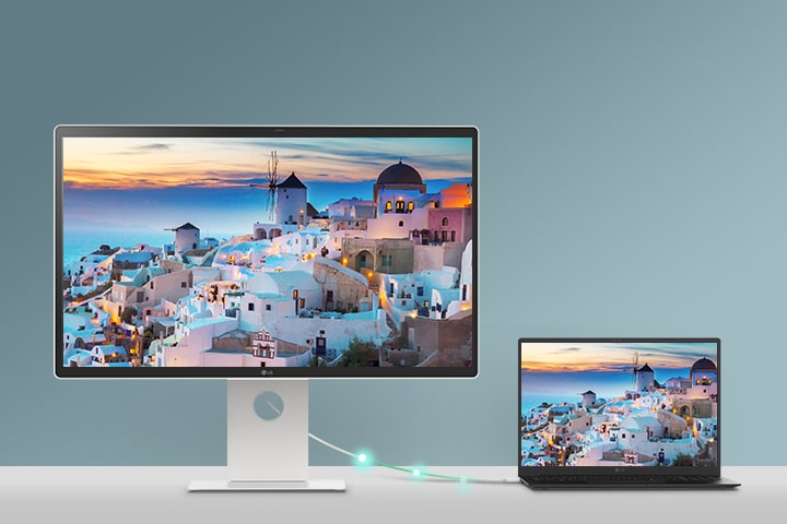 A laptop is connected to a LG Smart Monitor via USB-C. It is charging through USB-C while displaying the same screen.