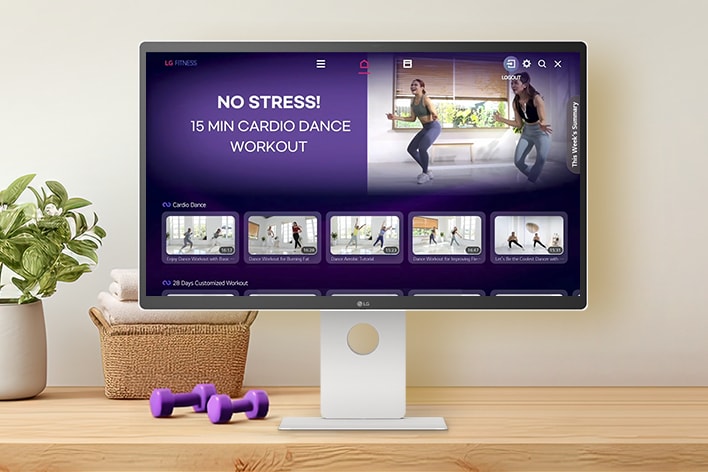 The LG Smart Monitor screen is showing various LG Fitness videos.
