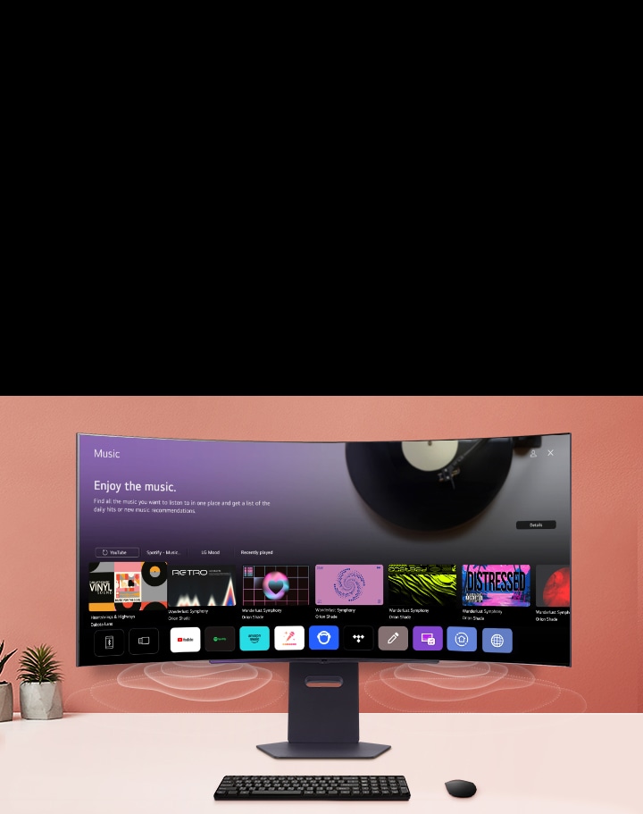 The smart monitor screen placed on the table displays the MUSIC APP screen.	