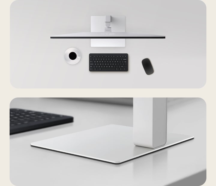 Top and angled views of an monitor setup on a clean desk, featuring a coffee cup, wireless keyboard, mouse, and a sleek, low-profile stand that ensures stability and saves space.