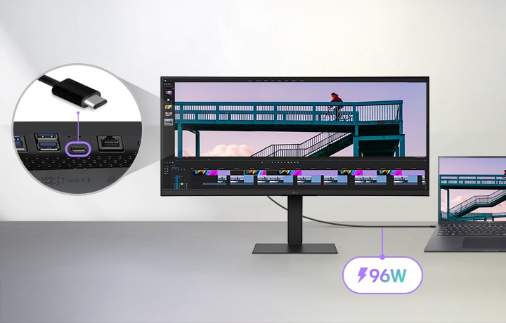 A USB Type-C cable connecting a laptop to an LG ultra-wide monitor, with a close-up showing the USB-C port on the back of the monitor and a video editing program running on both screens.