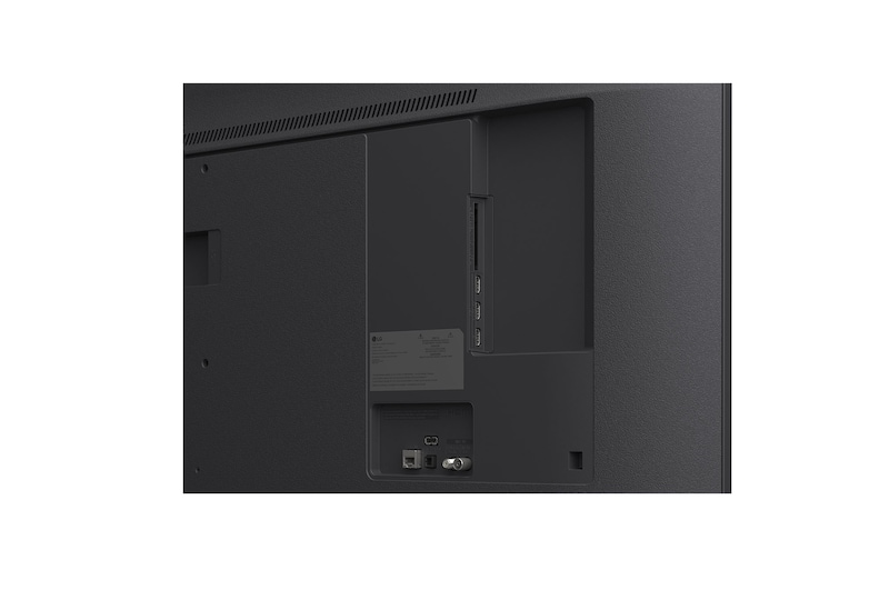 LG TV with an impressively large screen mounted on a wall above a LG Soundbar in a modern style living room.