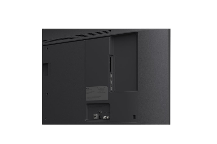 LG TV with an impressively large screen mounted on a wall above a LG Soundbar in a modern style living room.