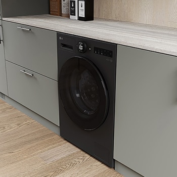 De matzwarte LG 11 kg wasmachine F4WX801YB, geïnstalleerd in een moderne keuken om het strakke, geïntegreerde ontwerp te benadrukken.