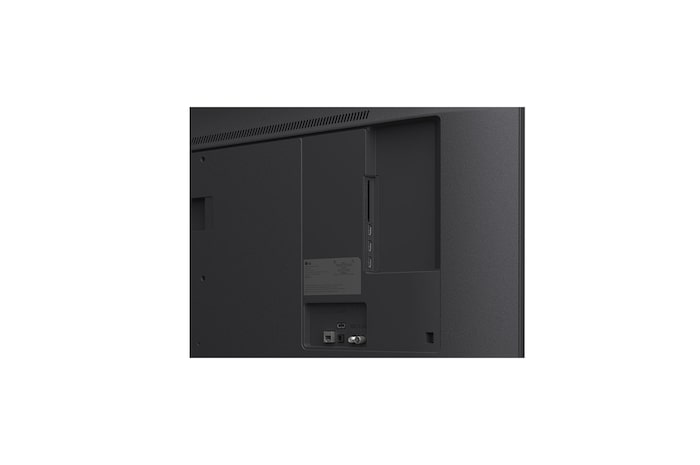 LG TV with an impressively large screen mounted on a wall above a LG Soundbar in a modern style living room.