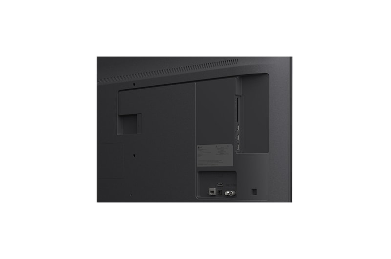 LG TV with an impressively large screen mounted on a wall above a LG Soundbar in a modern style living room.