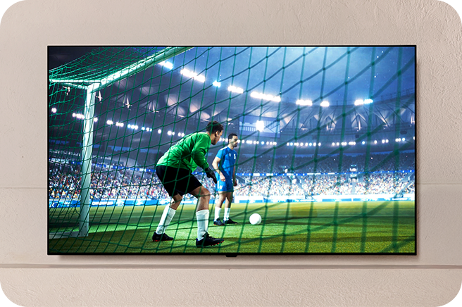 Imagem da TV OLED exibindo uma partida de futebol