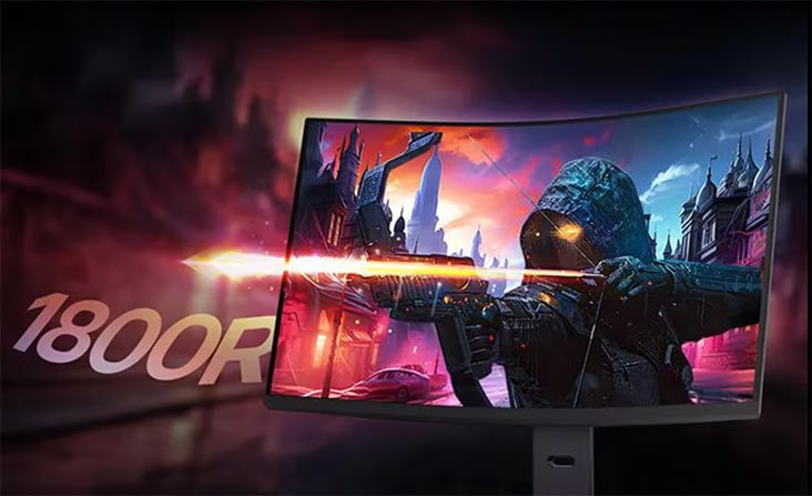 Uma imagem mostrando as cores deslumbrantes do monitor, com tinta roxa, vermelha e azul explodindo à frente da tela, e os logos sRGB 99% e HDR no canto inferior direito.