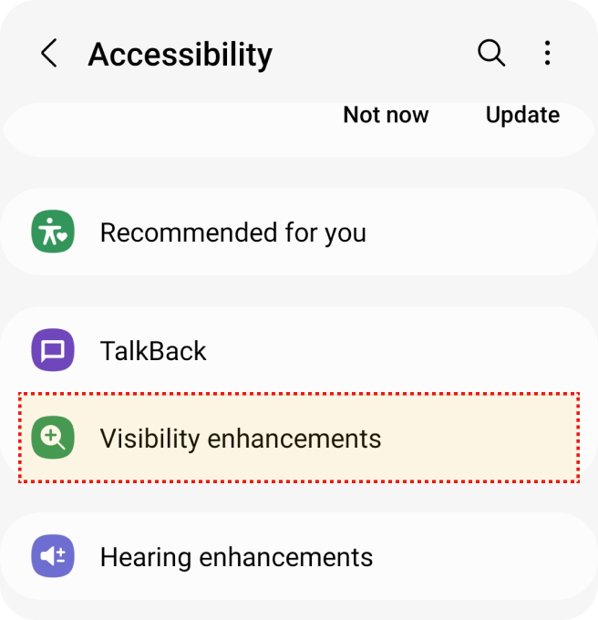 Tela de acessibilidade mostrando opções como 'TalkBack' e 'Melhorias de Visibilidade' no meio da tela.