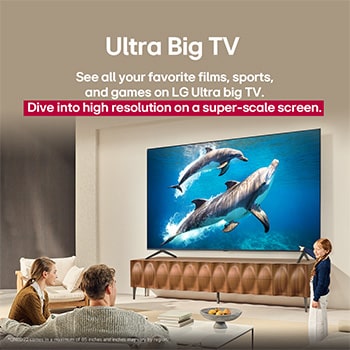 A family sits on a couch facing a LG QNED TV sitting above a TV stand with a little girl pointing to a screen depicting two dolphins. The title talks about how you can enjoy high resolution on a massive screen.