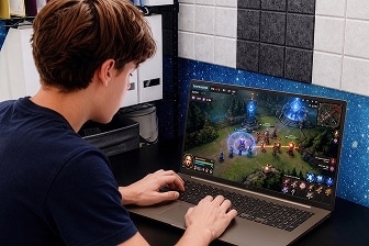 Student enjoying a game on an LG gram laptop at home.