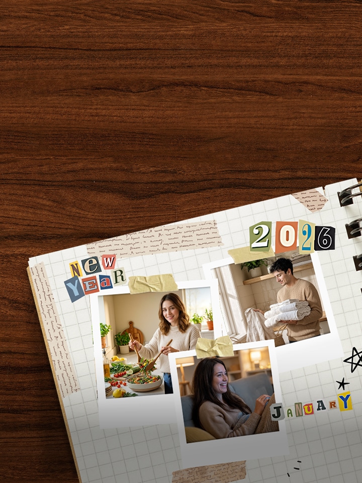 A diary on a brown desk featuring a collage of New Year decorations and Polaroid photos of people enjoying LG appliances