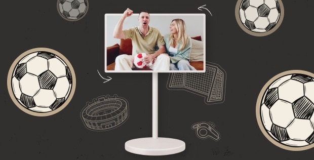 A couple watches a soccer match on a monitor and celebrates a goal with excitement. The scene is surrounded by illustrated soccer-themed elements, including soccer balls, a stadium, a goal net, and a referee whistle on a dark background.