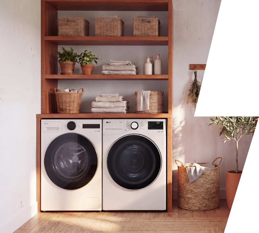 A white front-load washer and matching dryer are built into a wooden laundry cabinet, surrounded by neatly folded towels, woven baskets, and decorative plants.