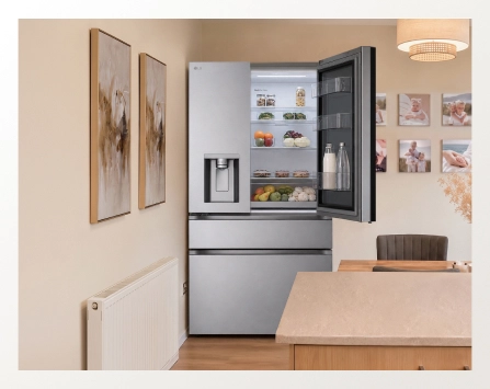 An open LG refrigerator shown from a wide view in a modern dining room.