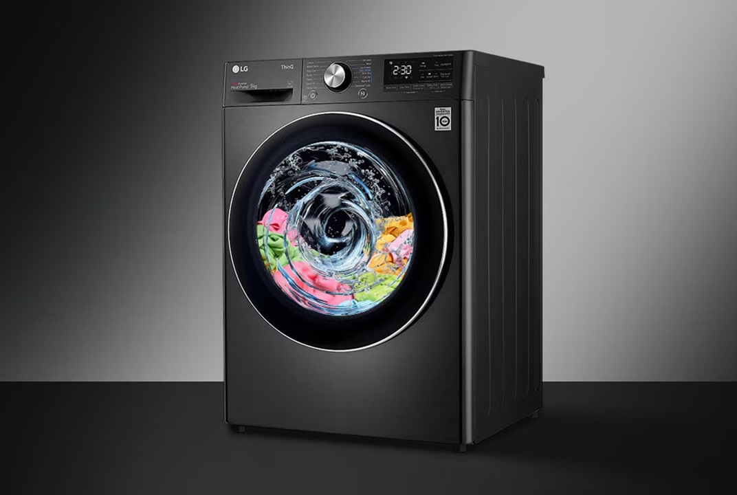 LG black front load washing machine with clothes spinning inside the drum showing high spin speed.