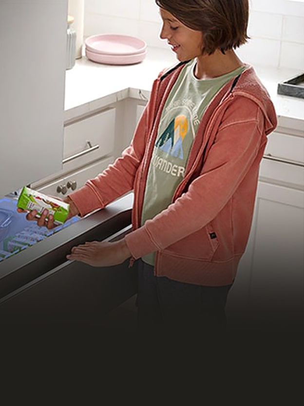 LG refrigerator drawer opened by a user with five temperature settings for wine, snacks, drinks, meat, and freeze illustrates the Full Convert Drawer.